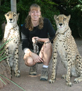 Photo of Christine Llewellyn with 2 cheetahs